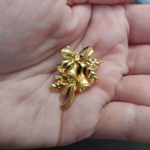 Roma gold tone holiday bell brooch